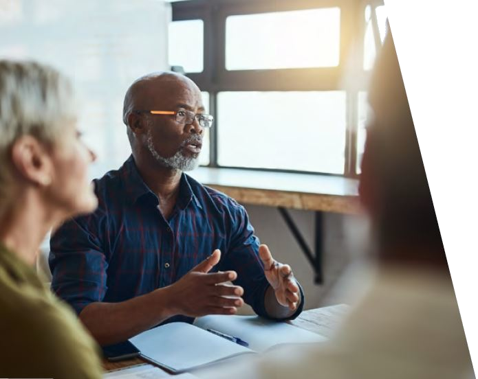 people speaking at table