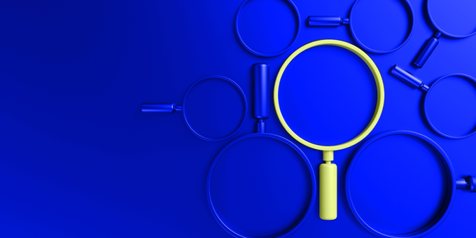 Magnifying glass over a blue background