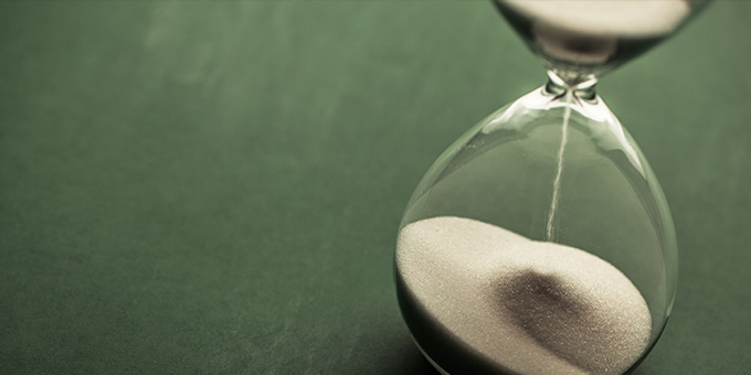 close up image of an hourglass expiring.