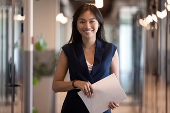 smiling business woman holding document
