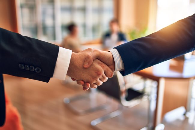 people shaking hands closeup