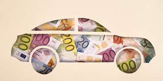 Automotive lender concept. Money in the shape of a car.