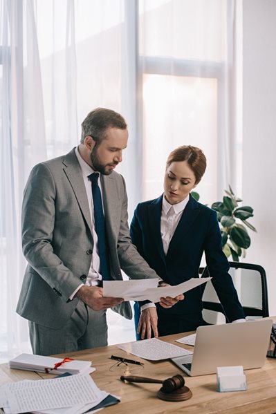 business people reviewing records documents